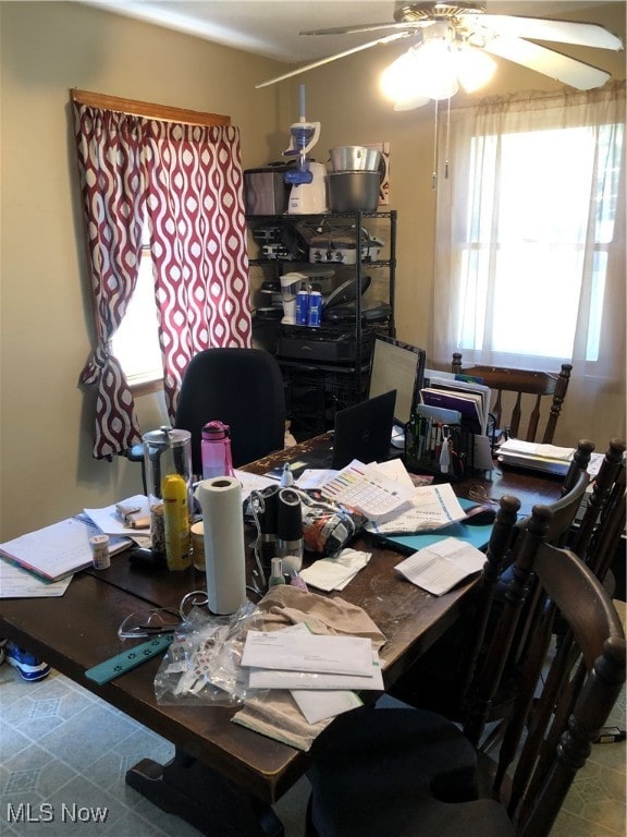 office with ceiling fan and tile patterned flooring