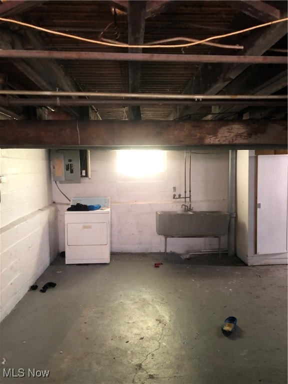 basement with washer / dryer, sink, and electric panel