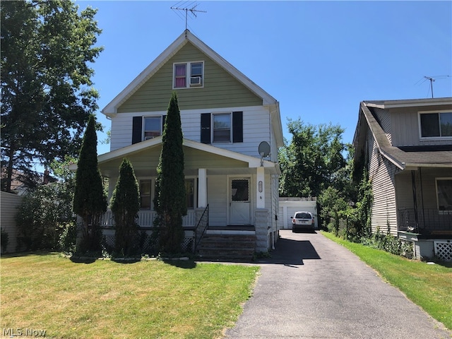 view of front of home with covered porch and a front yard