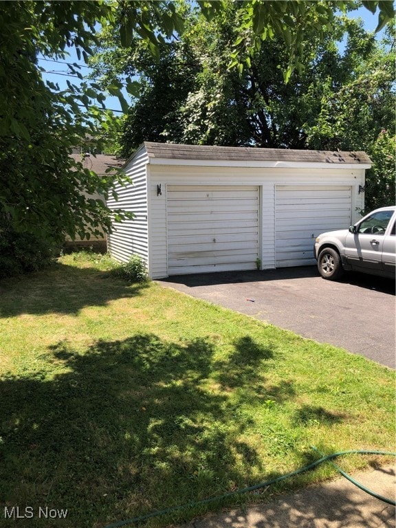 garage with a yard