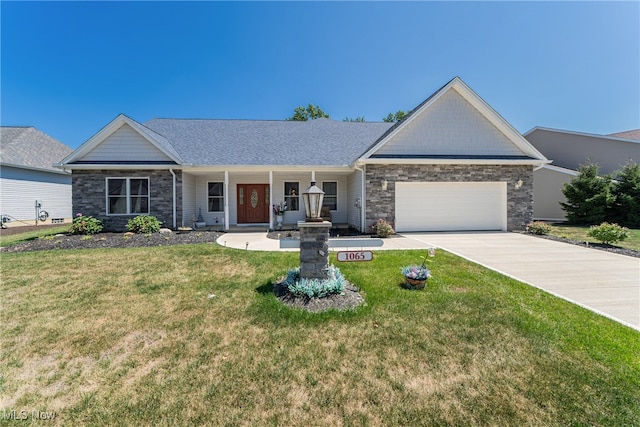 ranch-style home featuring a front lawn and a garage