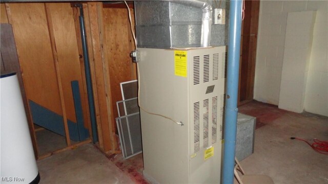 utility room with water heater and heating unit