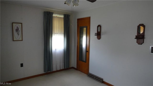 carpeted empty room with ceiling fan