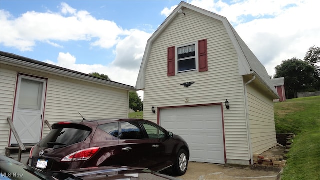 view of side of home with a garage