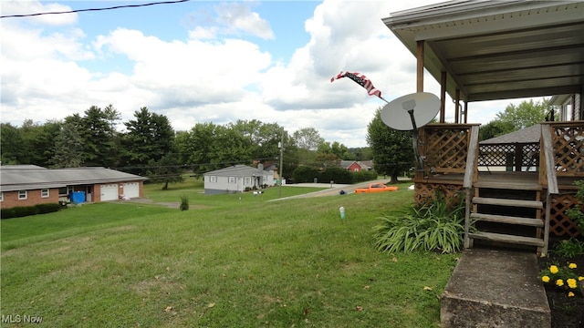 view of yard with a wooden deck