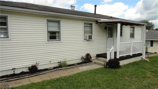 view of property exterior featuring a yard and cooling unit