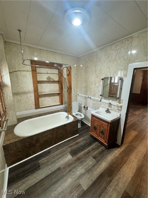 bathroom featuring vanity, tile walls, toilet, and ornamental molding