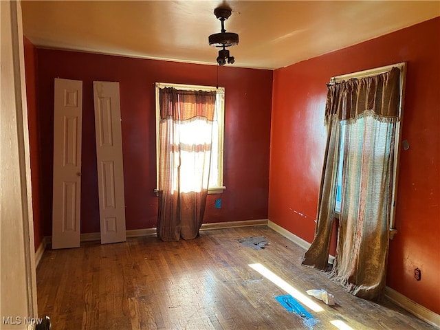 spare room with hardwood / wood-style flooring