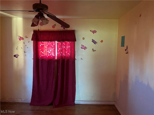 interior space featuring ceiling fan and wood-type flooring