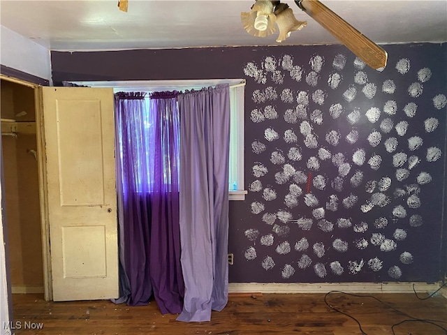 empty room with wood-type flooring