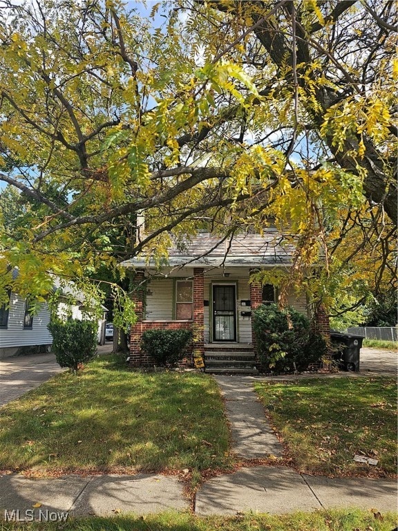 view of front of home with a front yard