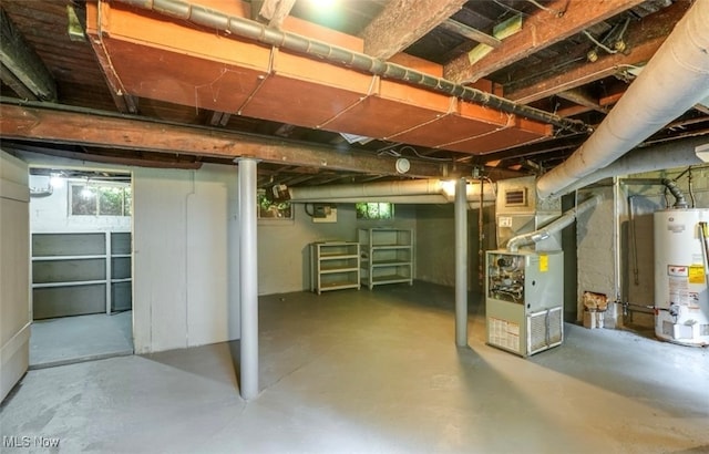 basement with water heater and heating unit