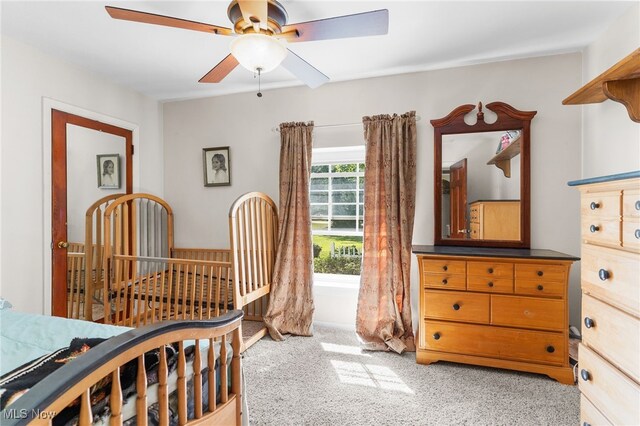 bedroom featuring ceiling fan and light colored carpet