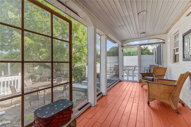 sunroom / solarium featuring wooden ceiling