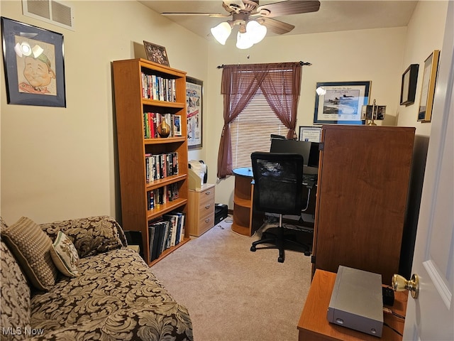 office featuring ceiling fan and light carpet