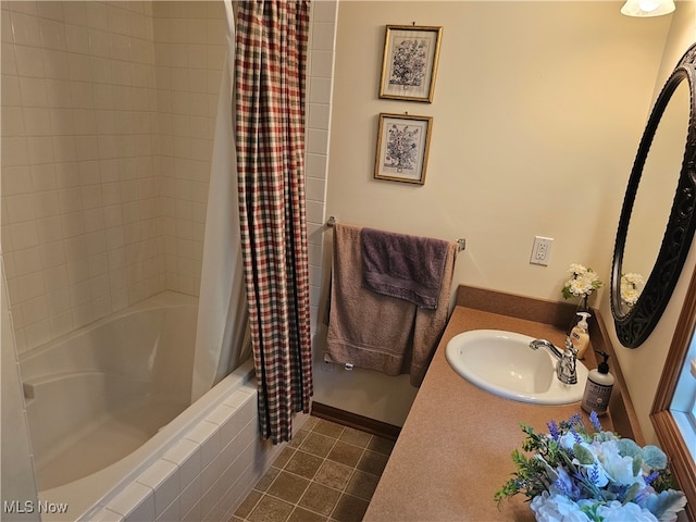 bathroom with tile patterned flooring, vanity, and shower / tub combo with curtain