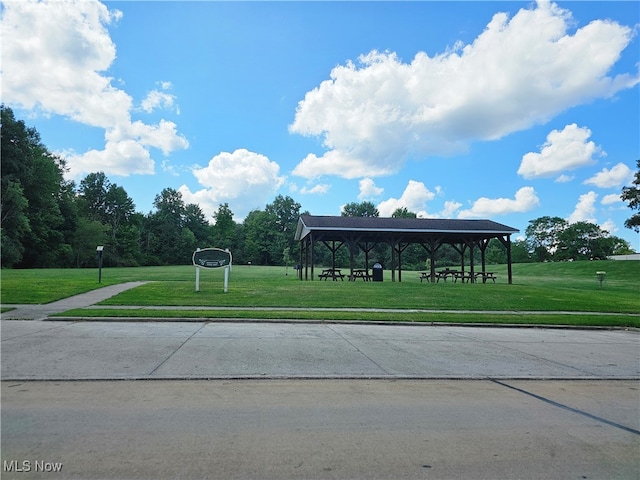 surrounding community with a gazebo and a yard