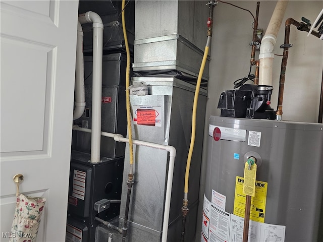 utility room featuring gas water heater