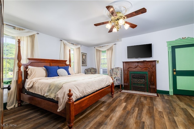 bedroom featuring dark hardwood / wood-style floors and ceiling fan