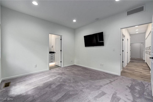 empty room with light colored carpet