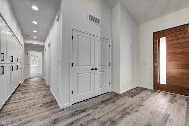 foyer with light hardwood / wood-style flooring