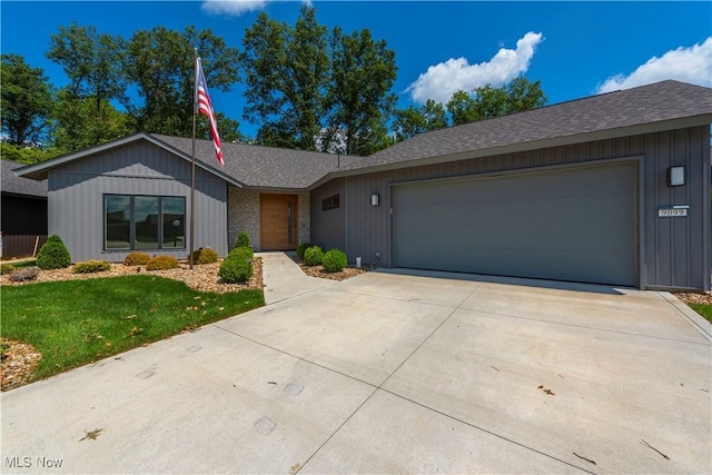 ranch-style house with a garage and a front yard