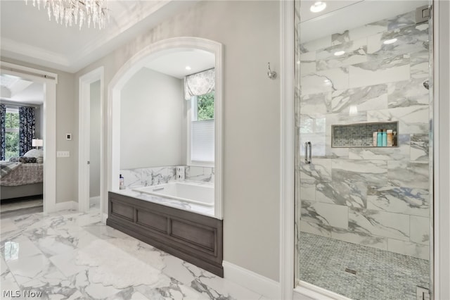 bathroom featuring tile patterned floors, a chandelier, and separate shower and tub