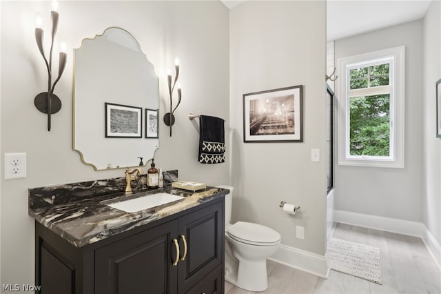 full bathroom featuring tub / shower combination, toilet, and vanity