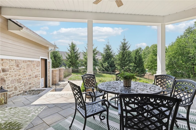 sunroom with ceiling fan and a healthy amount of sunlight