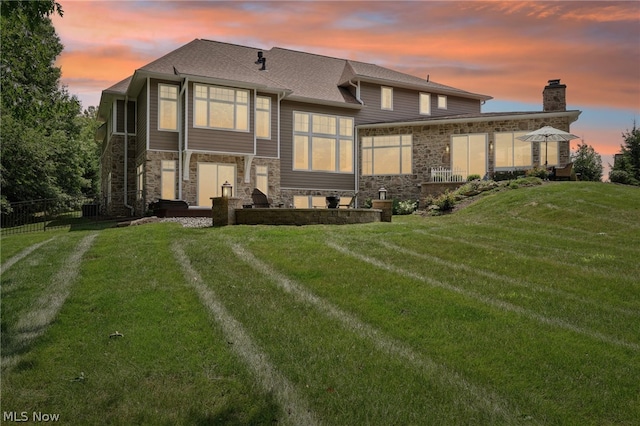 view of front of property with a yard