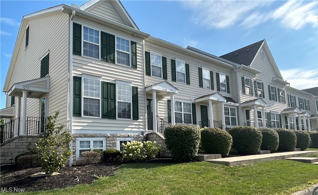 view of property with a front lawn