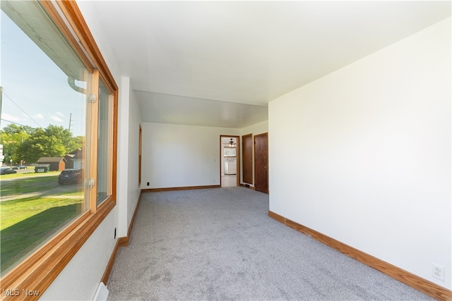 unfurnished room with light carpet