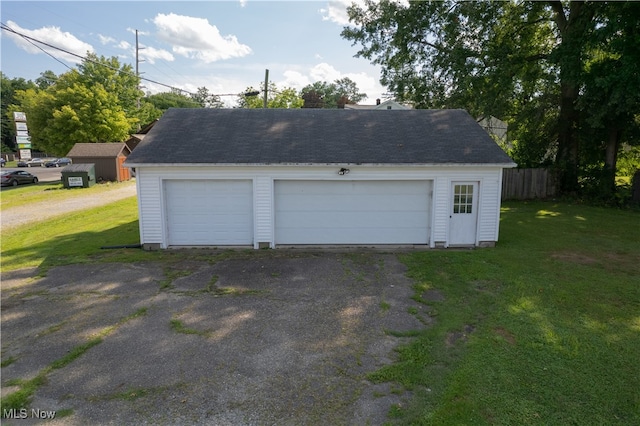 garage with a yard