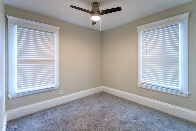 carpeted empty room with ceiling fan