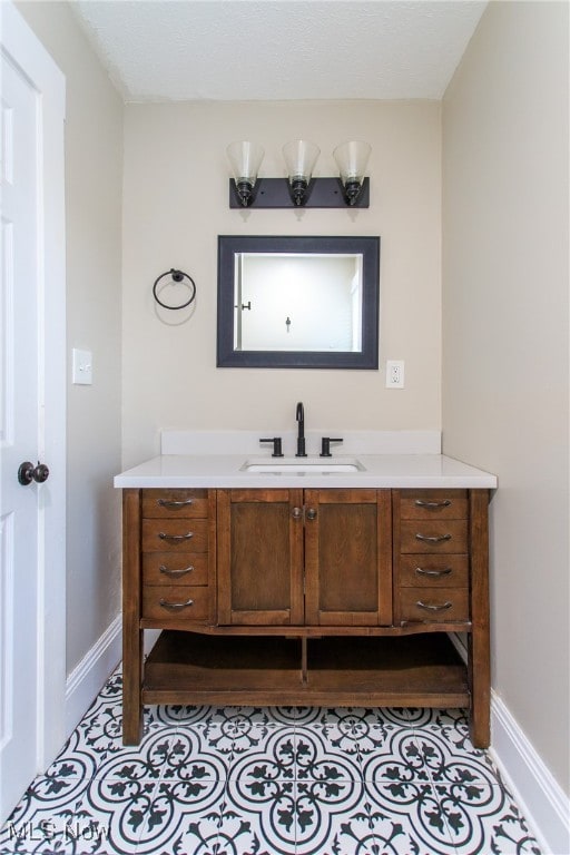 bathroom with vanity and tile patterned floors