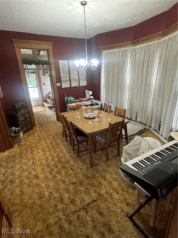 dining space with light carpet, a textured ceiling, and an inviting chandelier