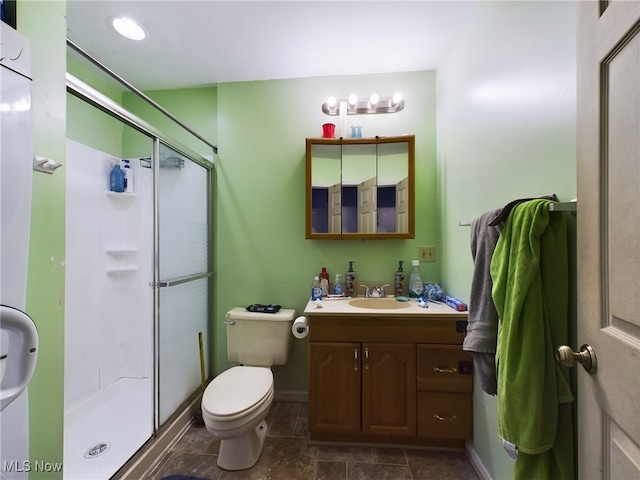 bathroom with an enclosed shower, tile patterned floors, vanity, and toilet