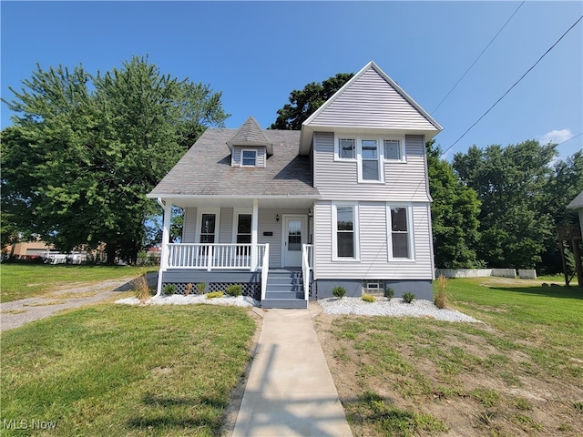 view of front of house with a porch and a front yard