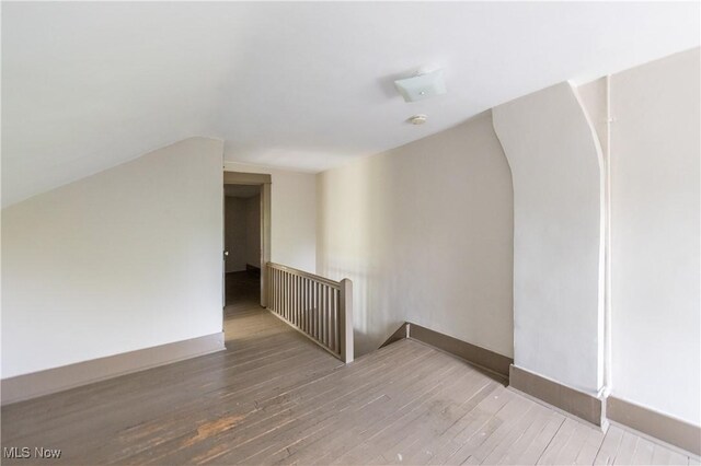 2572-2574 Mayfield Rd, Cleveland Heights, OH 44106 - additional living space with wood finished floors and vaulted ceiling