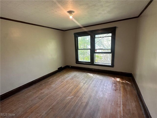 2572-2574 Mayfield Rd, Cleveland Heights, OH 44106 - empty room featuring ornamental molding, wood-type flooring, and a textured ceiling