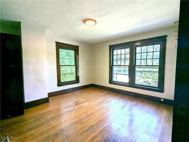 2572-2574 Mayfield Rd, Cleveland Heights, OH 44106 - unfurnished room featuring plenty of natural light and hardwood / wood-style floors