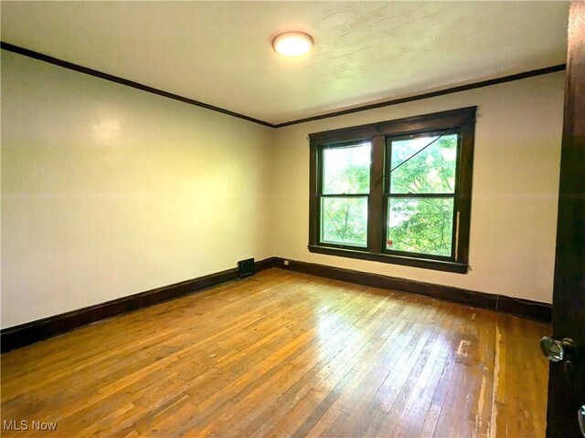 2572-2574 Mayfield Rd, Cleveland Heights, OH 44106 - empty room featuring ornamental molding and wood-type flooring