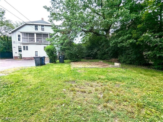 2572-2574 Mayfield Rd, Cleveland Heights, OH 44106 - view of green lawn featuring asphalt driveway