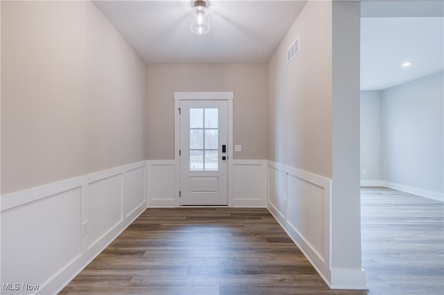 doorway to outside featuring dark hardwood / wood-style floors