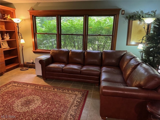 living room featuring a baseboard radiator and tile patterned flooring