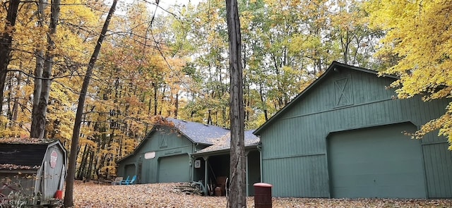 view of property exterior featuring an outdoor structure