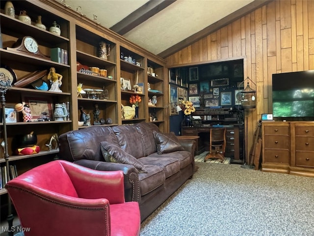 living room featuring vaulted ceiling with beams, wooden walls, and carpet flooring