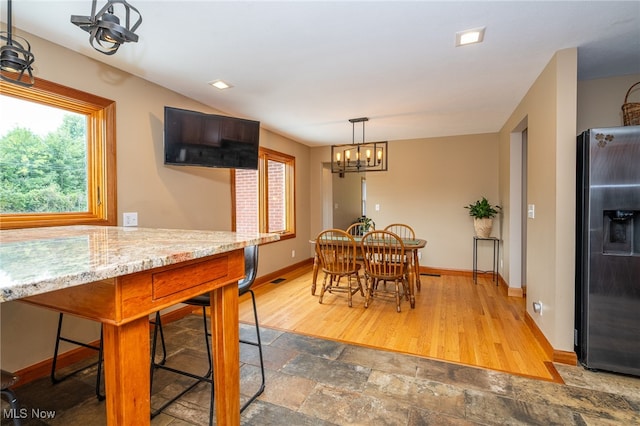 dining area with wood-type flooring