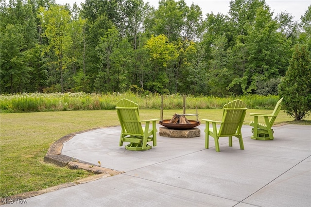 view of patio / terrace featuring an outdoor fire pit