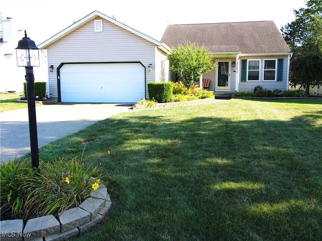 ranch-style home featuring a front lawn, driveway, and a garage